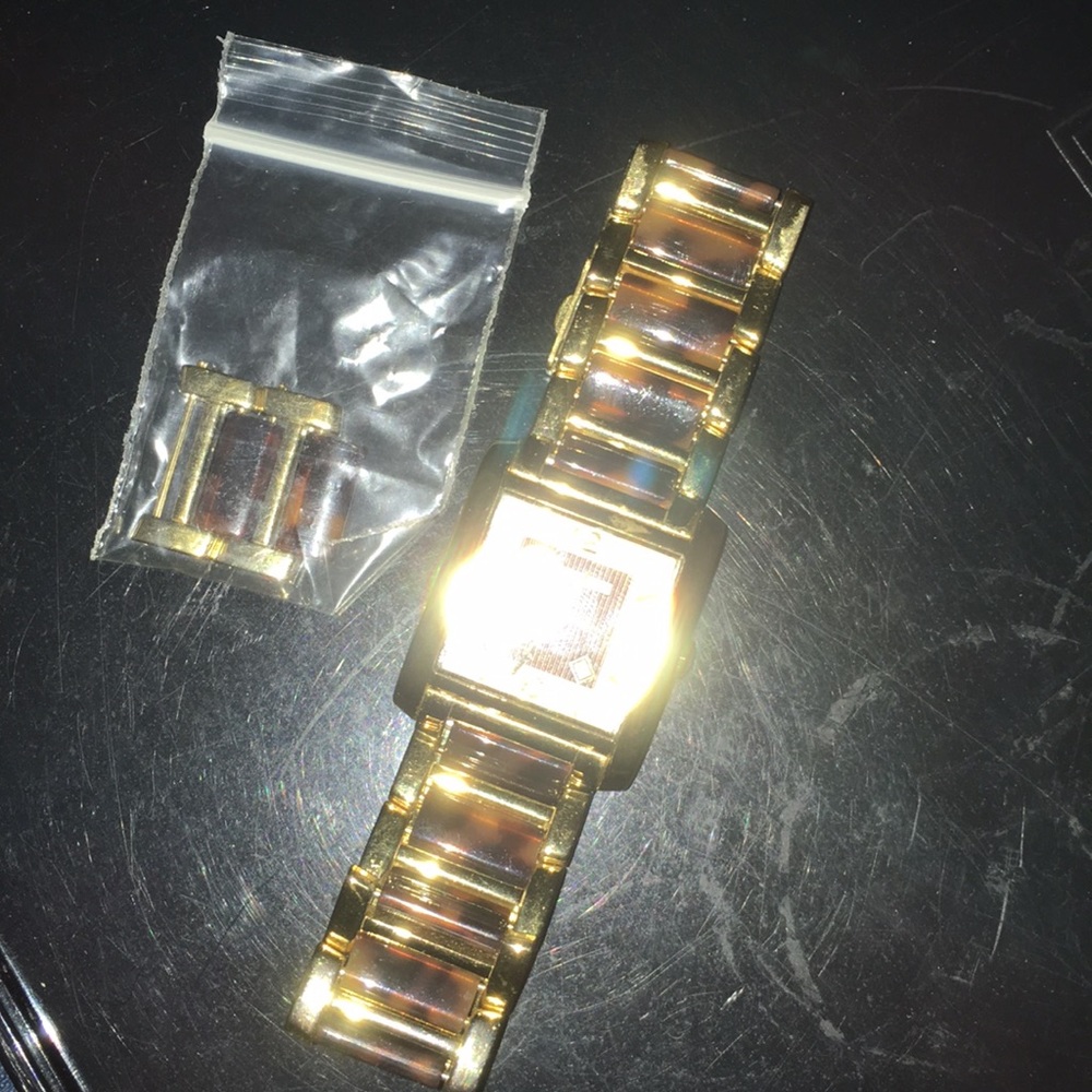 Tortoise and gold watch